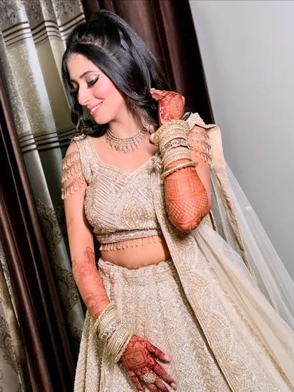 A similar pose to the previous one, capturing the elegance of her look from a slightly different angle.