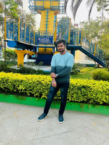 Posing in front of one of the rides at Fun World amusement park.