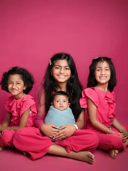 The most adorable siblings I have had the pleasure of shooting. The coordinated outfits and bright smiles make this a truly special family portrait.