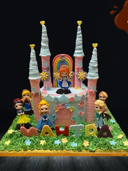 A cake fit for royalty, this large castle design features multiple Disney princesses like Snow White and Elsa around its base. The detailed castle structure with its tall turrets makes for a truly magical centerpiece.