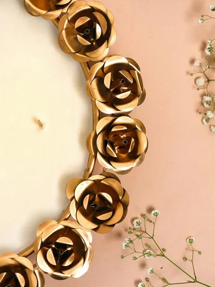 It’s all in the details. A close-up of the beautiful metal roses that adorn our popular urli candle bowls.