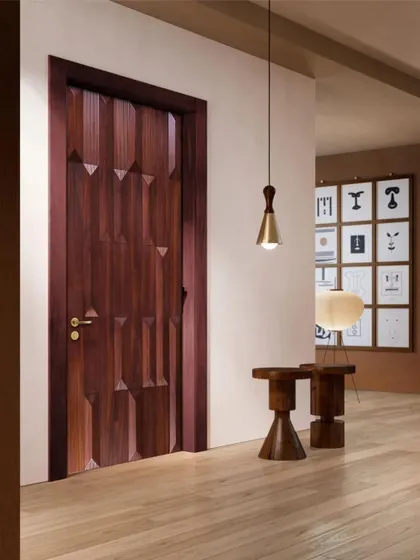 This door features a 3D geometric pattern that adds depth and character. The rich wood veneer and precise angles make it a standout piece for a modern home.