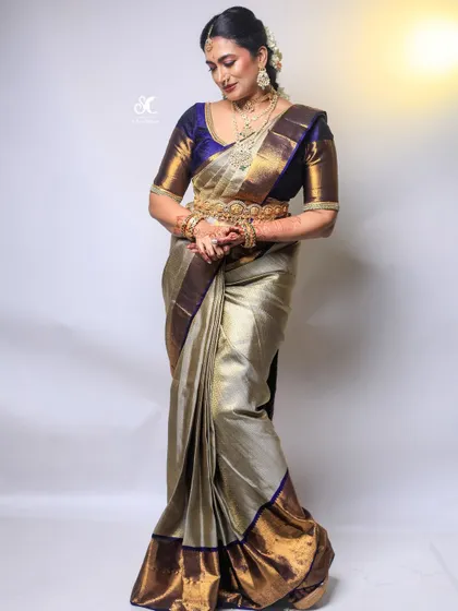 My all-in-one package includes professional saree draping to ensure your Kanjivaram or any other silk saree is pleated and pinned to perfection. This full-length view shows how a perfectly draped saree completes the entire bridal look.