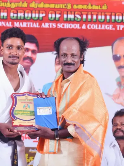A proud moment for one of my students as he receives an award and certificate during the closing ceremony. Recognizing each student's effort is an important part of our program.