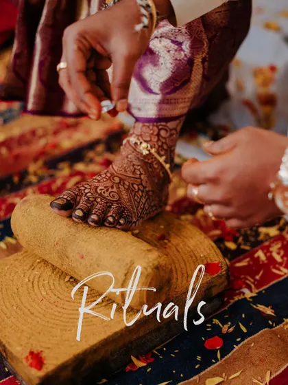 Focusing on the details of tradition. This shot captures the toe ring ritual, a significant and symbolic part of the Hindu wedding ceremony.