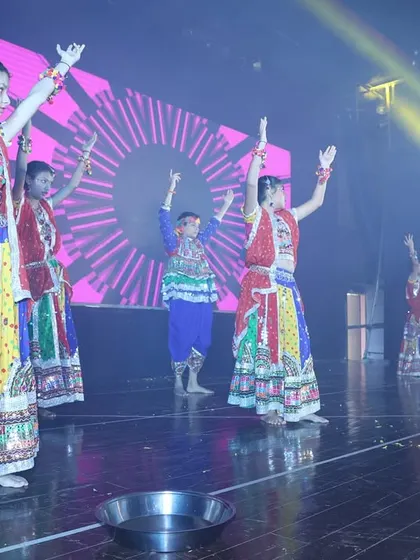 A vibrant folk dance performance from our annual showcase, featuring traditional costumes and dandiya props.