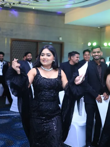 Leading the audience in a dance at the Housiey annual event. A little bit of music and movement can unite the room and create lasting memories.