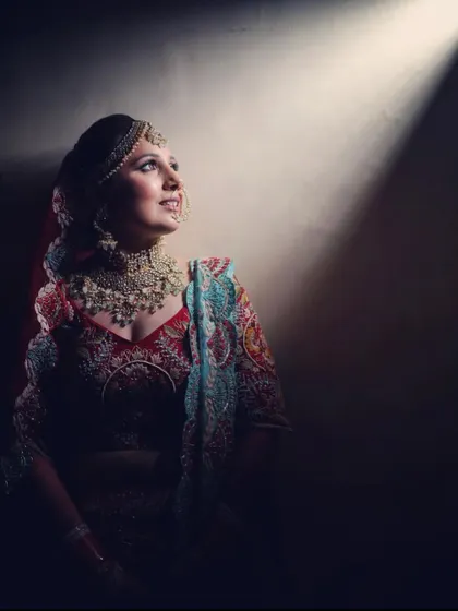 A dramatic, artistic shot of our bride Swati Khurana, looking like a royal queen in her bridal attire and our jewellery.