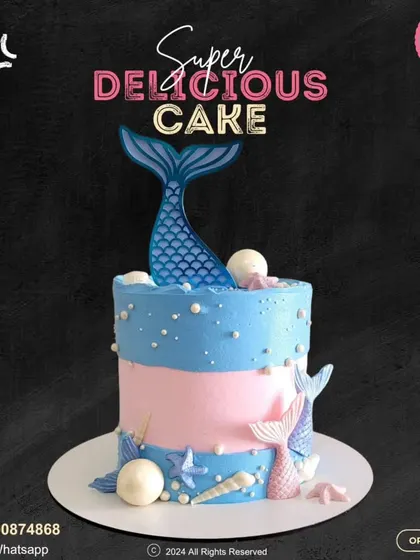 A beautiful mermaid-themed cake with pink and blue layers. This design is decorated with shimmering mermaid tails, pearls, and seashells, creating a magical under-the-sea vibe.