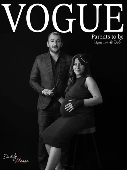 A sophisticated black and white couple's portrait styled as a Vogue cover. This image captures the elegance and partnership of the parents-to-be.
