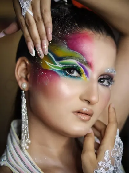 A full-face view of the colorful look, showing the student's skill in blending and creating graphic shapes.