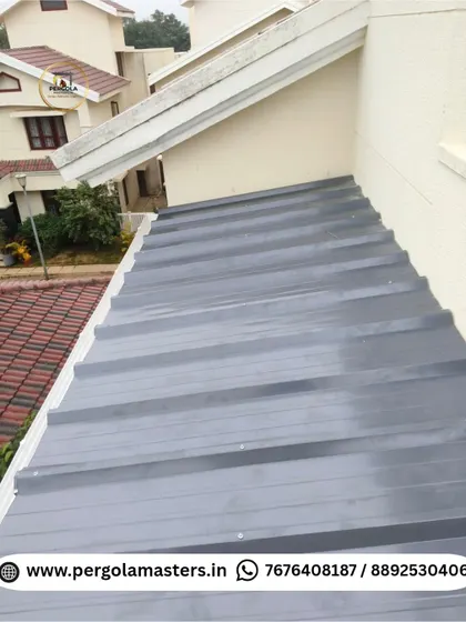 The exterior view of a newly installed puff sheet roof. The corrugated metal surface is durable and designed to efficiently manage rainwater, providing a long-lasting, low-maintenance roofing solution.