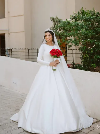 Another shot of this stunning bride. The simplicity of her gown allows her natural beauty and radiant smile to be the focus.
