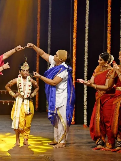 A beautiful moment of blessing the young Krishna on stage. These interactions are the heart of the story.