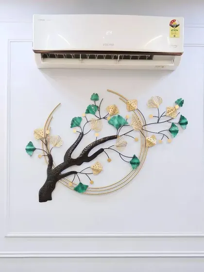 A close-up of the delicate metal wall art, showing how curated decor pieces can elevate the entire aesthetic of a room.