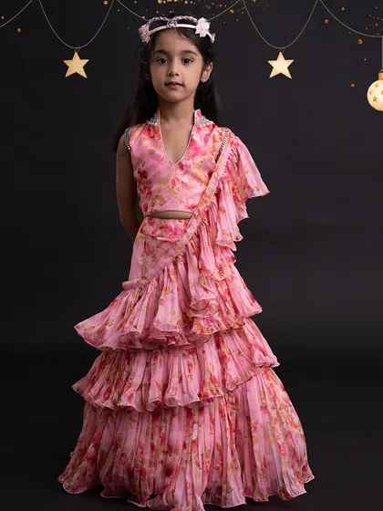 A beautiful floral lehenga set, showcasing our ability to work with delicate prints and create layered looks.