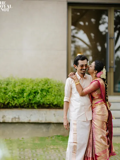 A sweet moment captured after the wedding. The bride's saree remains perfectly pleated, a testament to my meticulous draping technique.