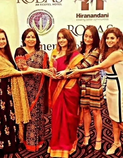 A candid shot from the Women Achievers Awards, holding the trophy with fellow recipients. These are the moments that remind me why I do what I do.