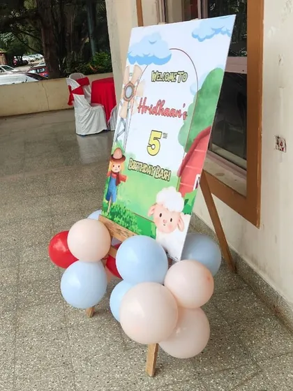 A welcome board for a farmland-themed birthday party.