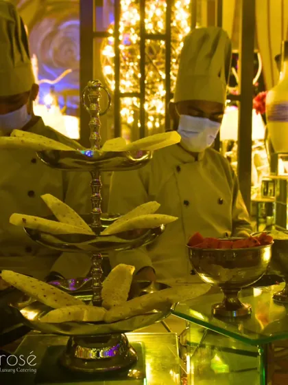 Our chefs working at a live station during an outdoor event. We ensure our team maintains the highest standards of hygiene and professionalism, even in a busy environment.