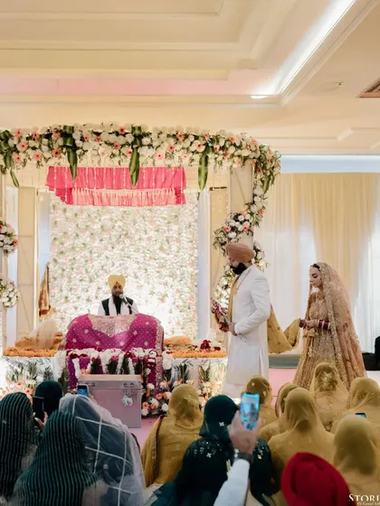 The couple paying their respects during the Anand Karaj ceremony, a moment of deep spiritual significance.