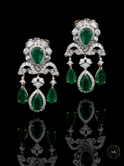 A statement jewel is your voice, your aura, your story. These emerald and diamond chandelier earrings are crafted for women who command a room without saying a word.