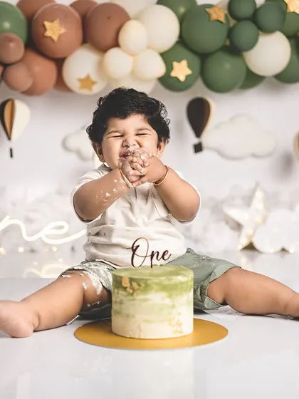 The best part of a cake smash is getting to eat the cake! This little guy is enjoying every bite.