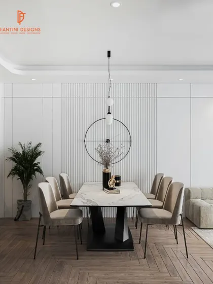 The dining area is designed for memorable meals. The marble-top table, comfortable velvet chairs, and striking wall clock come together to create a space that is both stylish and welcoming.