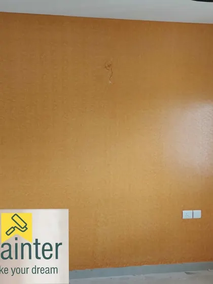The same mustard textured wall, demonstrating a consistent and professional application across the entire surface.