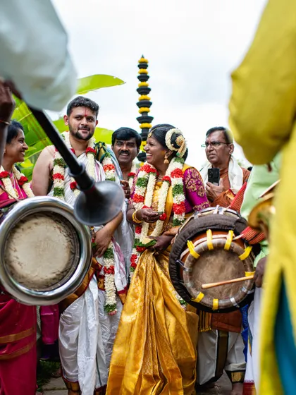 The vibrant sounds of traditional music mark the couple's entrance. I coordinate with all vendors, including musicians, to ensure every part of the wedding day is seamless and memorable.