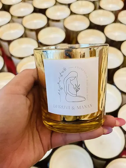 The matching custom scented candle from the luxury baby announcement hamper.