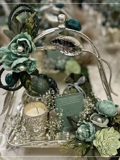 Inspired by nature's elegance, this hamper from the Gilded Grove Collection is a harmonious fusion of artistry and craftsmanship. The silver-plated tier, adorned with green earth stones and delicate florals, is perfect for wellness-focused employee gifts or as a sophisticated thank-you gesture.
