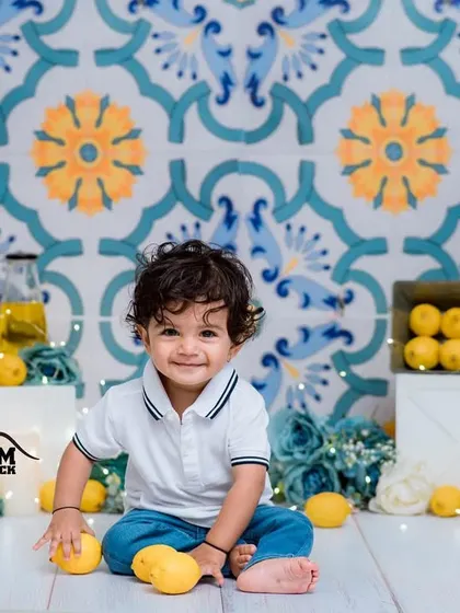 A beautiful studio setup for our lemon splash session, featuring a tiled backdrop and vibrant blue and yellow props.