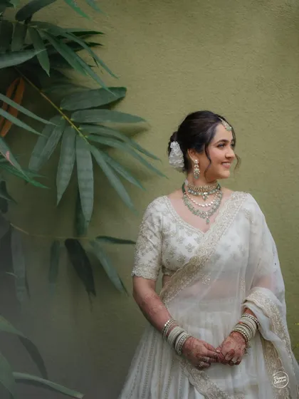 A smiling, candid portrait of the bride, looking effortlessly beautiful and happy.