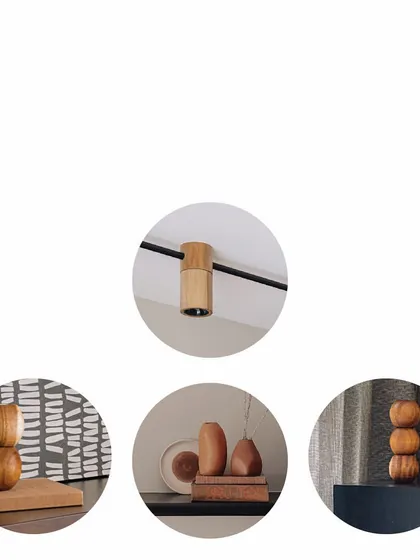 Details make the design. This shows our custom wooden jacket for a track light, and various hand-turned wooden curios. These small, sculptural objects add dimension and personality, layering the space with objects of curiosity.