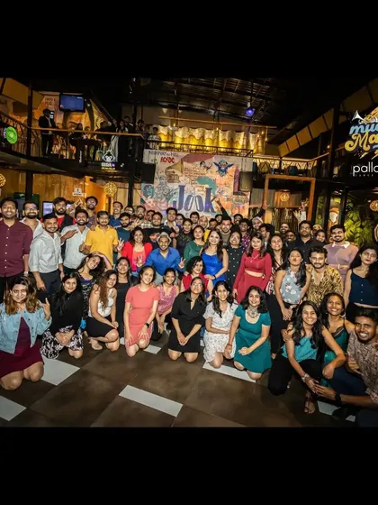 We are more than a dance school; we are a community. This is our crew at a "Mucho Mambo" social night, celebrating our shared passion for dance and connection.