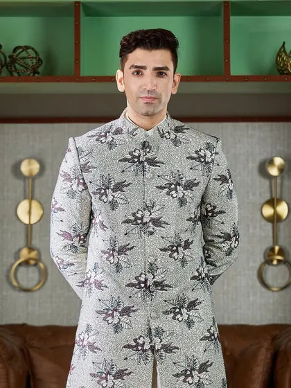 For a bold and artistic statement, I designed this floral printed Indo-Western jacket. The monochrome print is modern and eye-catching, perfect for a Mehendi or Sangeet.