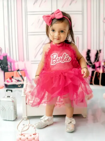For a fun and fashionable first birthday, this Barbie-themed shoot is perfect. I style the set with chic, playful props to create a vibrant backdrop for your little one's milestone photos.