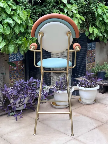 This beautiful custom bar chair was made for a client who loves fun and pop pieces. The combination of pastel colors, geometric shapes, and a sleek metal frame creates a cheerful and stylish accent.