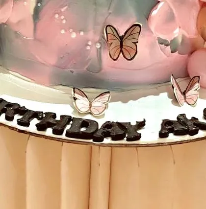 An identical shot of the lower tier of the birthday cake.