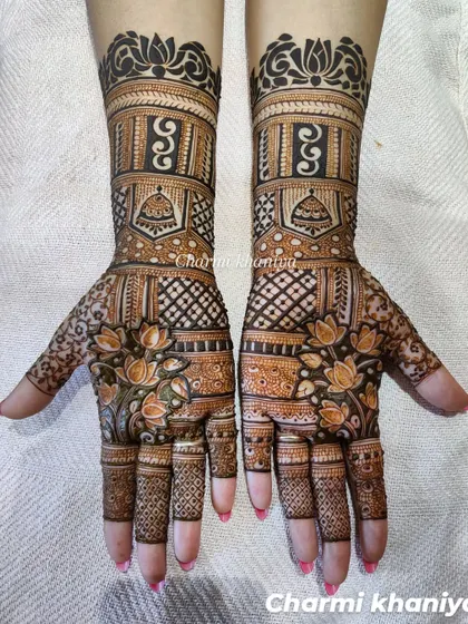 A gorgeous design with lotus flowers and traditional temple motifs. The bold, dark henna looks stunning.
