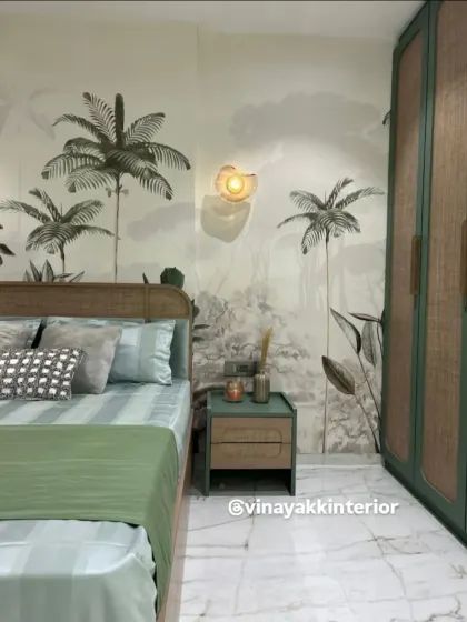 We brought the outdoors in with this nature-inspired bedroom. The tropical mural behind the bed creates a stunning focal point, complemented by the rattan headboard and sage green accents for a fresh, organic feel.