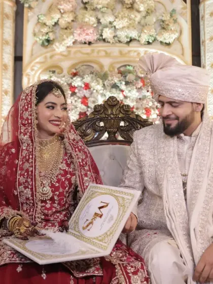 The signing of the Nikahnama, the marriage contract. This is a key moment in a Muslim wedding, and I focus on the couple's happy interaction as they make it official.