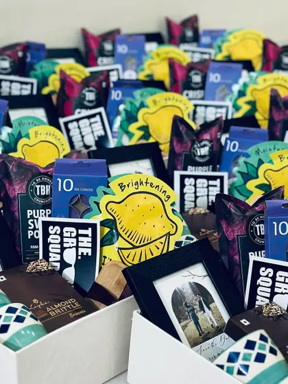 A close-up shot showing the variety of snacks and goodies packed into our groomsmen gift boxes.