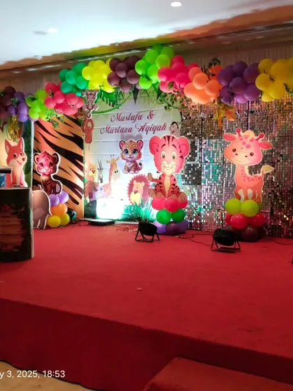 A view of the jungle stage setup from the side, showing the depth and layers of the decoration.