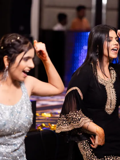Two friends enjoying the dance. Our goal is to make the choreography so much fun that you can't help but smile.