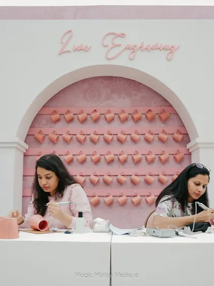 Artists at work at the custom-designed live engraving counter, providing a unique and interactive experience for guests.