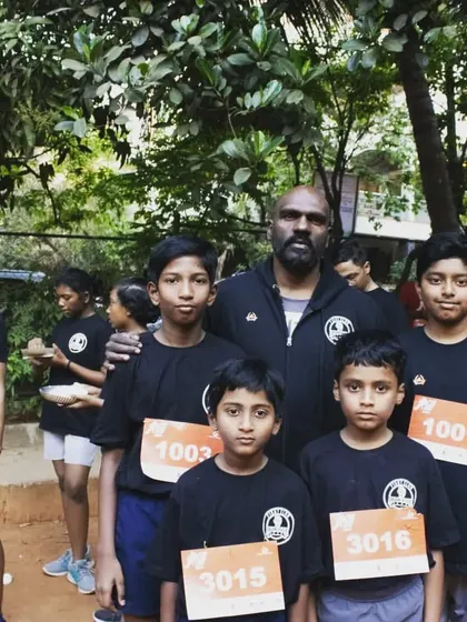 Leading the youngest members of our team at a local running event. Building discipline and a strong work ethic starts early and extends beyond martial arts training.