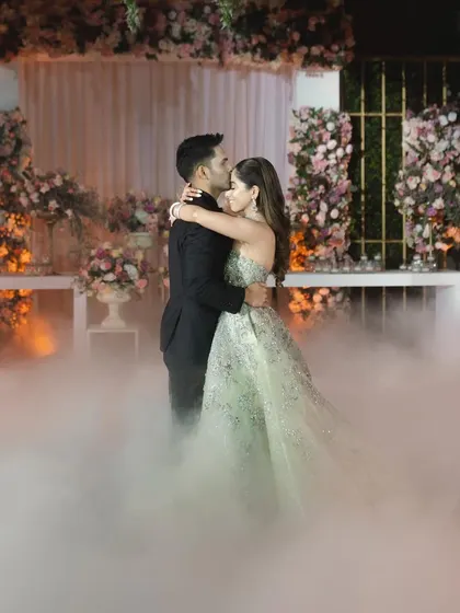 A dreamy couple dance surrounded by low fog. This effect creates a magical, 'dancing on clouds' feeling that is perfect for a romantic performance.