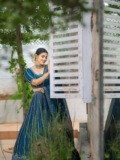 A beautiful shot from another designer collaboration. The deep blue lehenga is paired with a soft, smokey eye and a neutral lip.